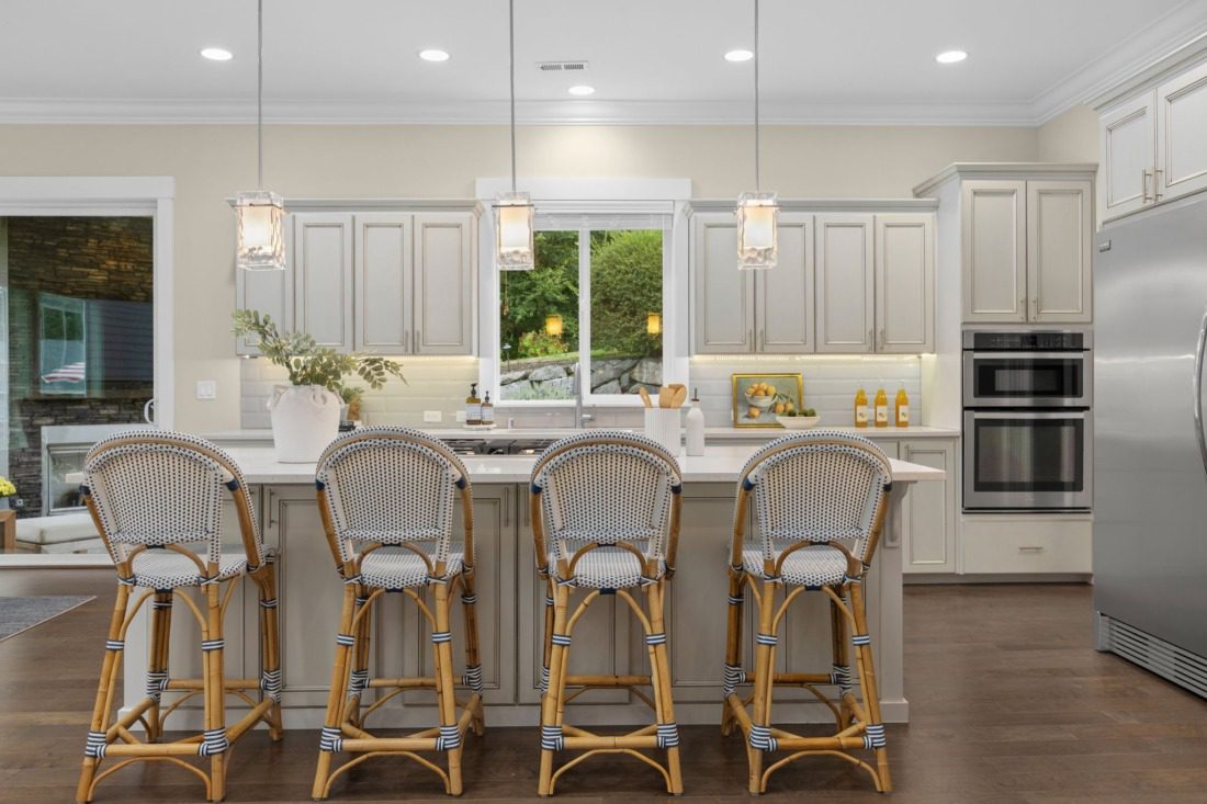 chefs kitchen with large island and oversized appliances in gig harbor