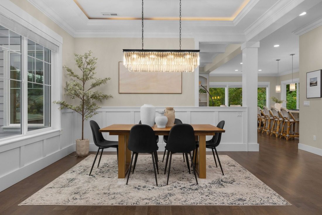 dinning room with large windows, hardwood floors and high-end lighting