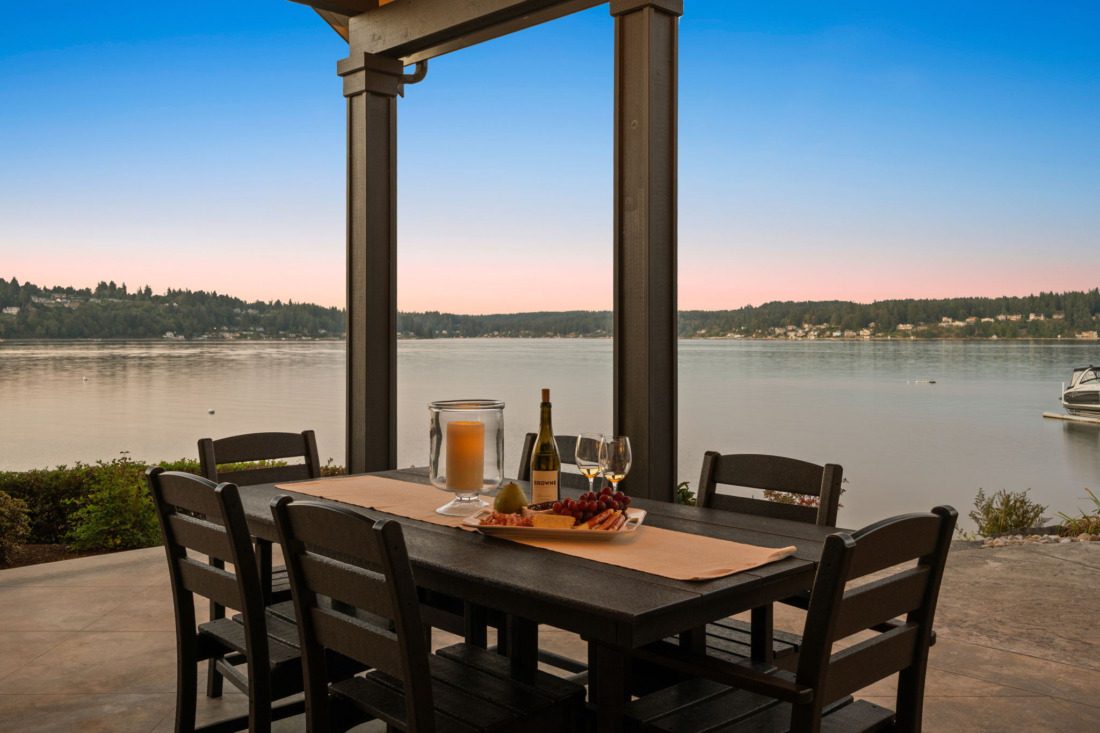 fox island outdoor dining area with views of hale passage in the distance